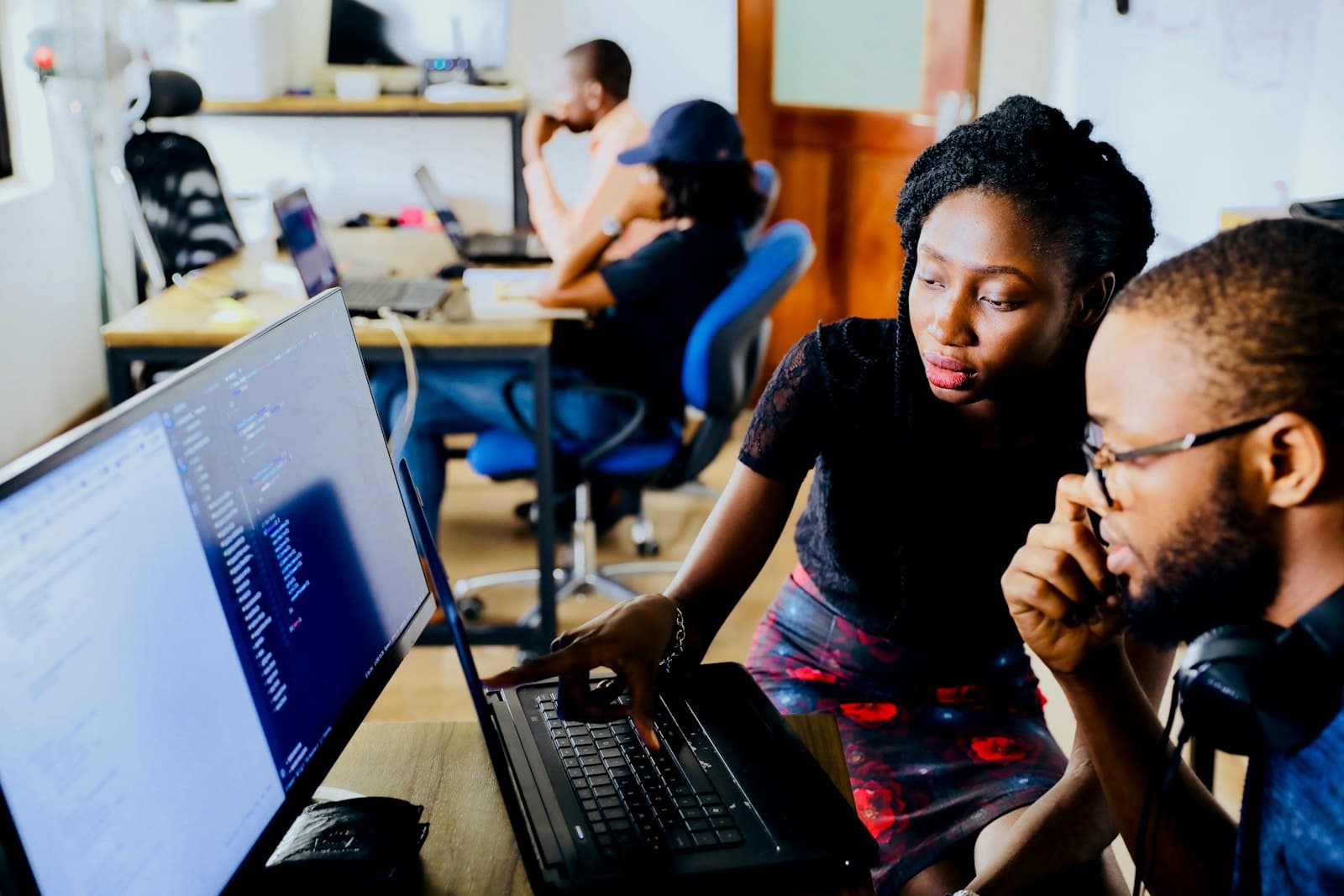 Two software developers building a custom business application together